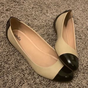Tan and black flats
